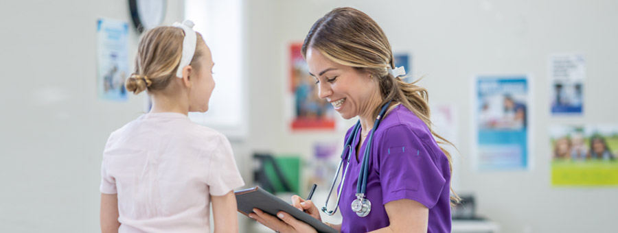 Medical staff examines patient and records notes in EMR.