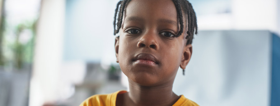 Portrait of serious young boy.