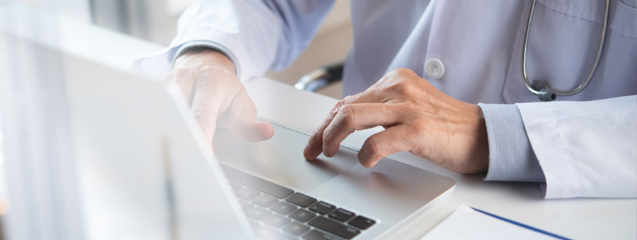 Doctor submitting an online report.