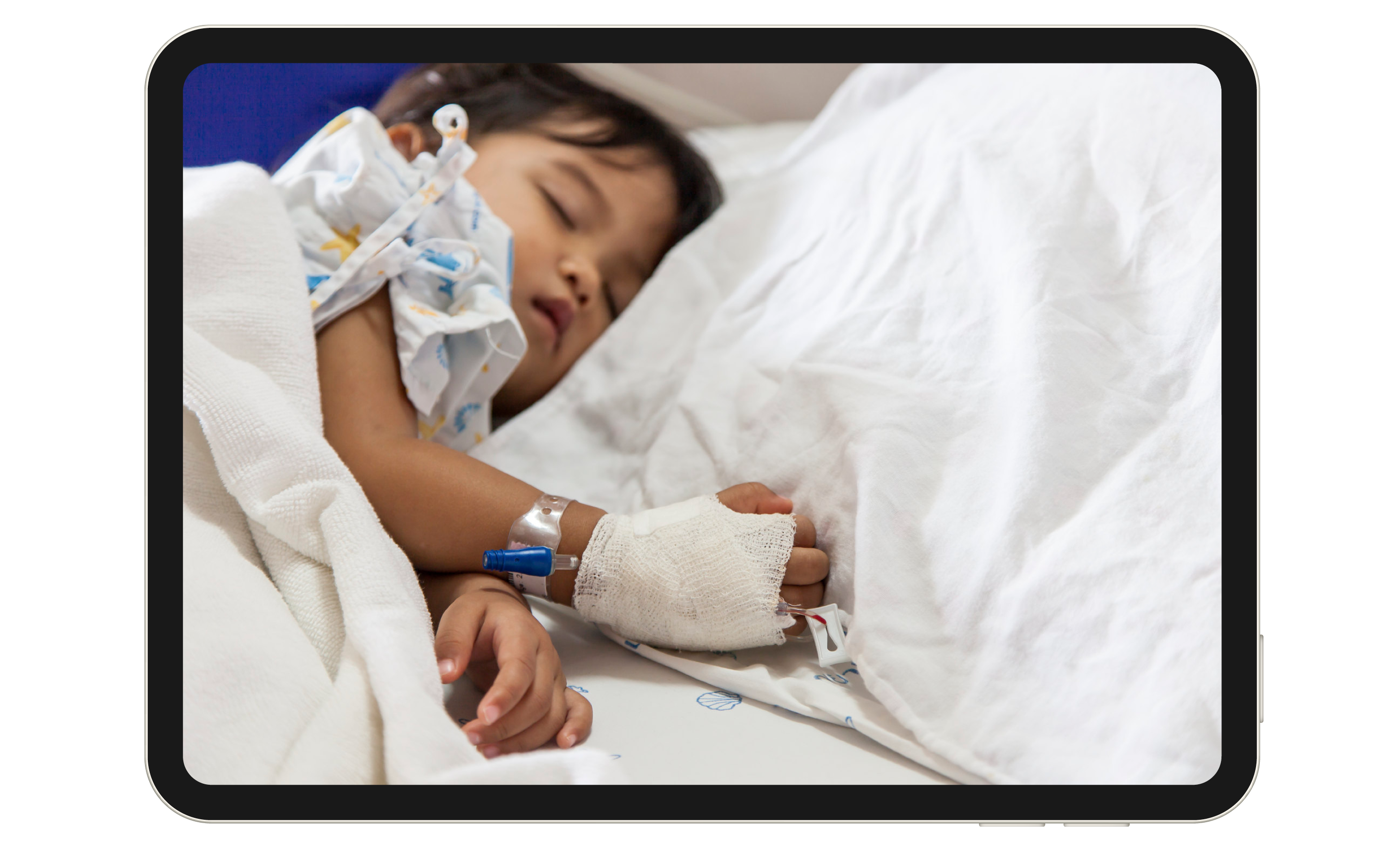 Young child patient in a hospital bed.