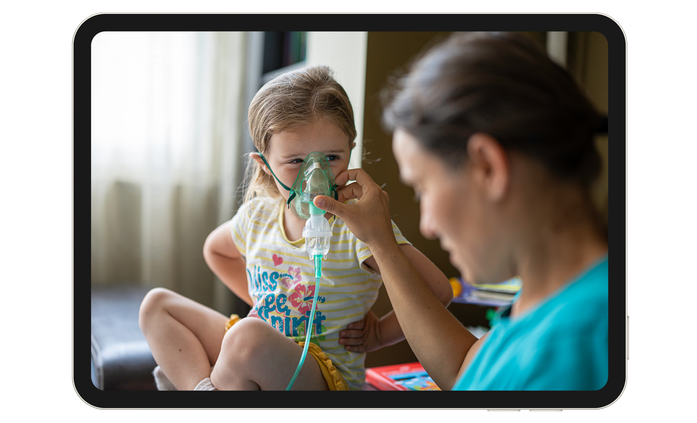 A nurse holding an oxygen mask up to a child's face.