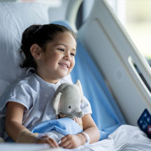 A girl patient receives care at a children's hospital.