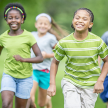 Happy kids running a race.